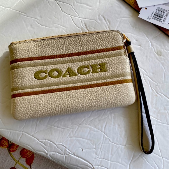 Coach Handbags - Coach mini pursed beige new with tags